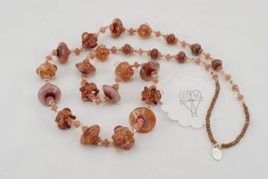 Handmade necklace with watermelon tourmaline and mauve glass beads.