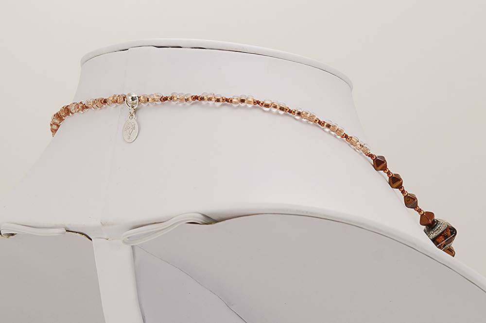 Brown, copper and grey colored glass bead necklace.
