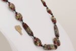 Dark red, grey and black glass bead necklace with raku effect and sterling silver accents.