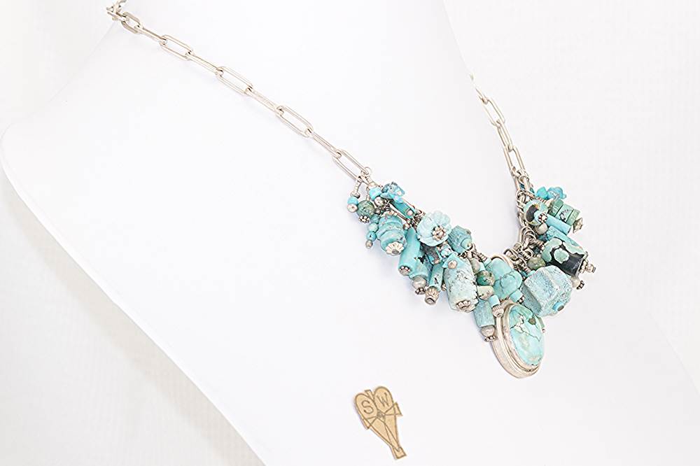 Statement necklace made with sterling silver and vintage turquoise trade beads.