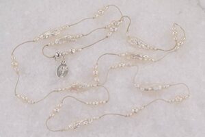 Freshwater stick pearl necklace with with round pearls.