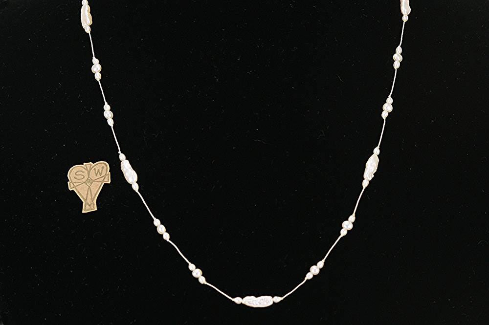 Necklace handmade with freshwater stick and round pearls.