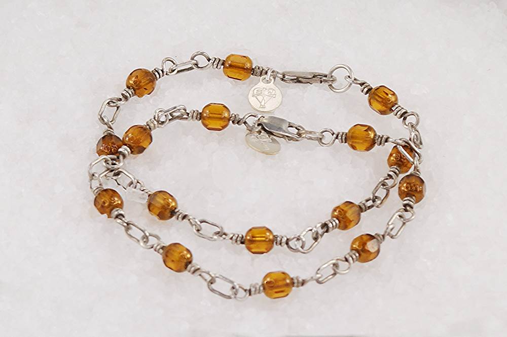 2 bracelet set made of copper colored glass beads with sterling silver.