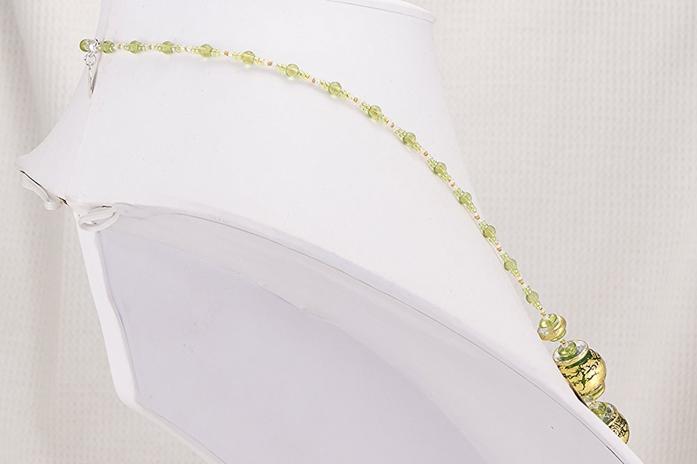 Necklace made of green and deep red hand blown glass beads with 18 kt gold leaf flaked finish.