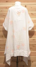 Chic white Italian linen cloak with pink flowered print and front pockets.