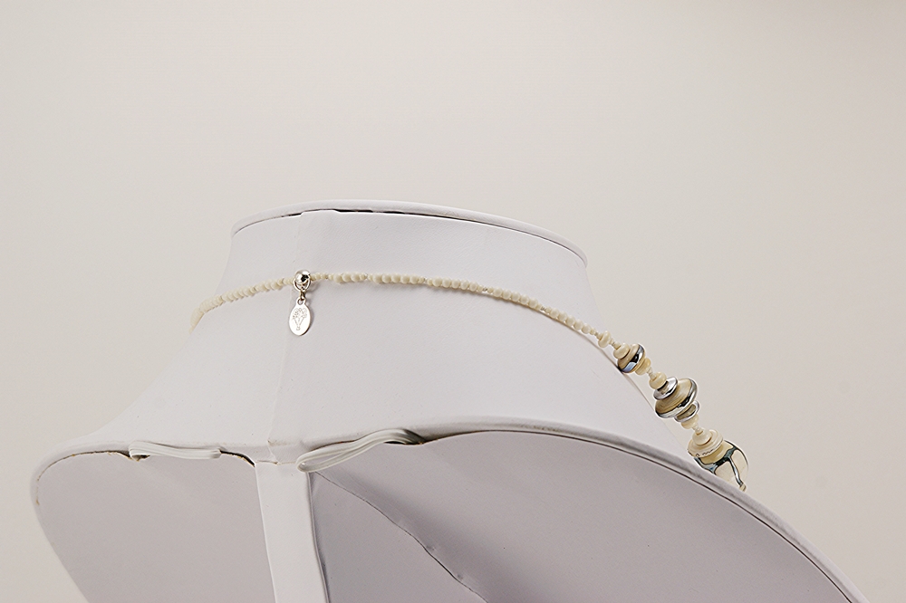 necklace made from ivory colored iridescent silver hand blown glass beads