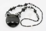 necklace with deep black and crystal clear glass beads