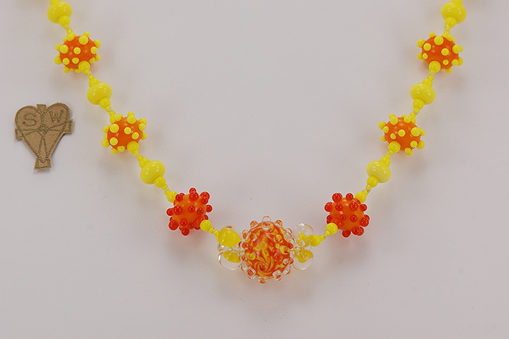 Bright orange and yellow bead necklace.