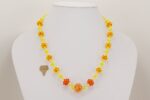 Bright orange and yellow glass bead necklace.