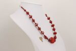 Necklace made of vintage Czech red suede glass beads with sterling silver accents.