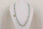 Turquoise and ivory glass bead necklace'