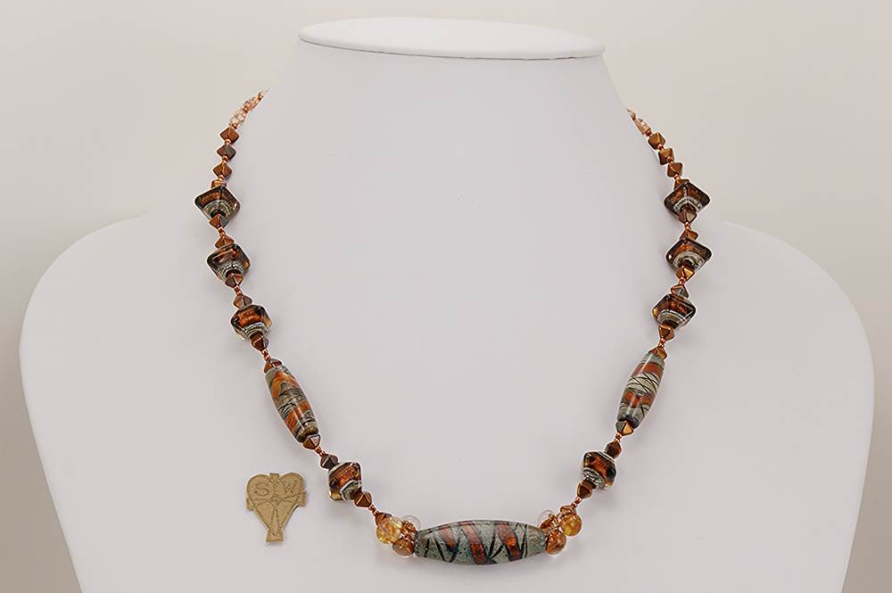 Copper brown and grey colored glass bead necklace.