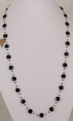Necklace made with black faceted spinel beads and freshwater pearls.