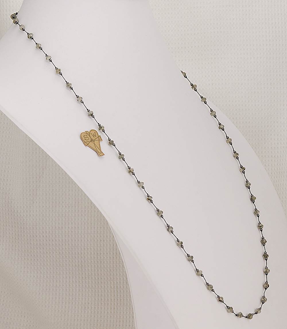 33 inch long necklace made with faceted, rutilated, black, smokey quartz and hematite beads.