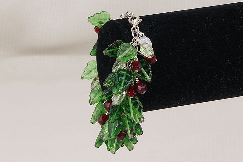 Bracelet with green and red glass holy leaves and berries.