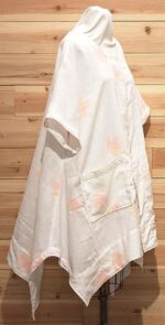 White linen chic cloak with pink flowered print and 2 front pockets.
