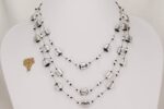 One of a kind, sterling silver, black and clear glass bead necklace.