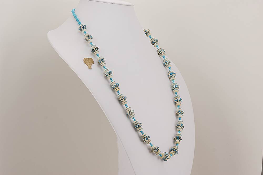 Ivory and turquoise colored glass beaded necklace.
