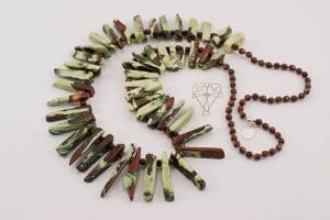 Watermelon bamboo coral beaded necklace with red jasper .