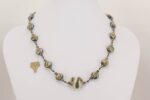 Grey and ivory colored glass bead necklace.