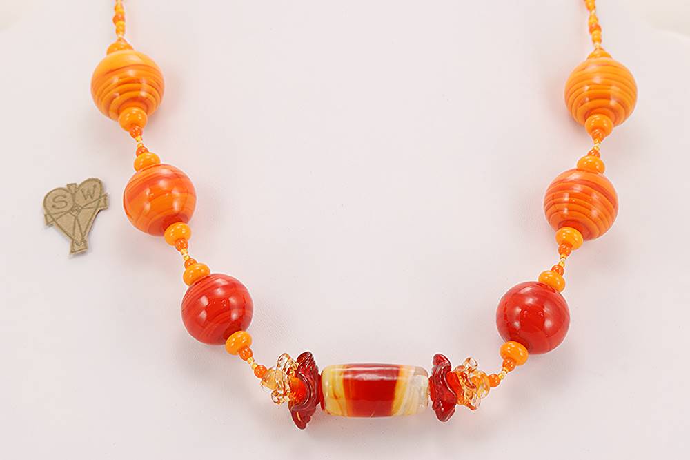 Bright orange, handmade, glass bead necklace.