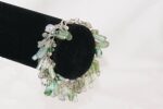 Handmade jade and moss agate bracelet on sterling silver chain.