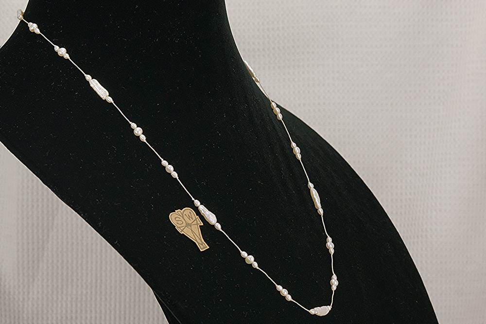Baroque freshwater stick and round pearl necklace.