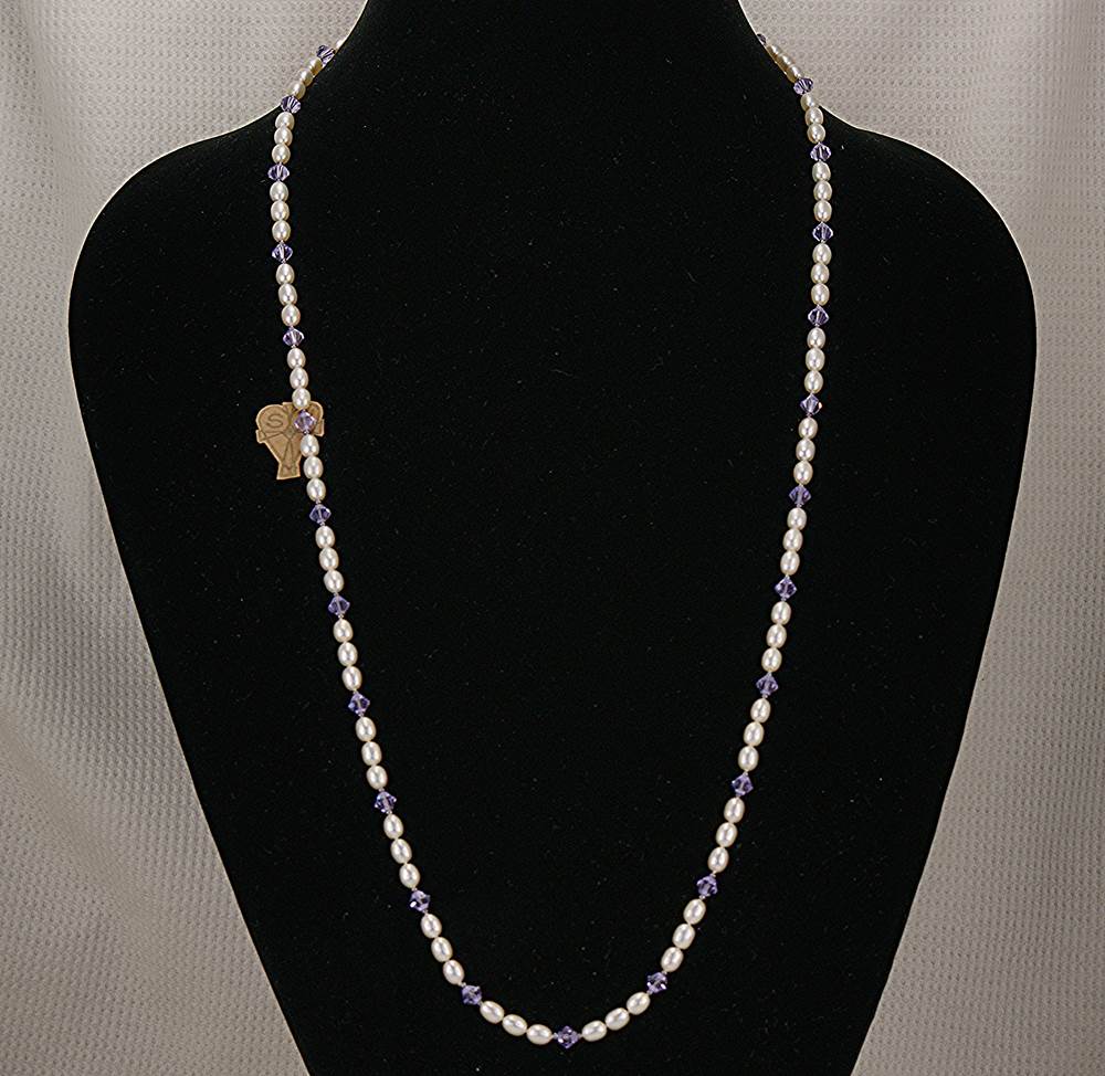 One of a kind, handmade, freshwater pearl necklace with purple Swarovski crystals.