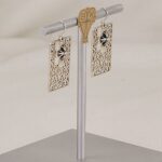 Handmade sterling silver flat scroll cut earrings with 3 dimensional crosses.