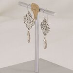 Quatrefoil earrings made of scroll cut pure sterling silver and quartz crytsals.