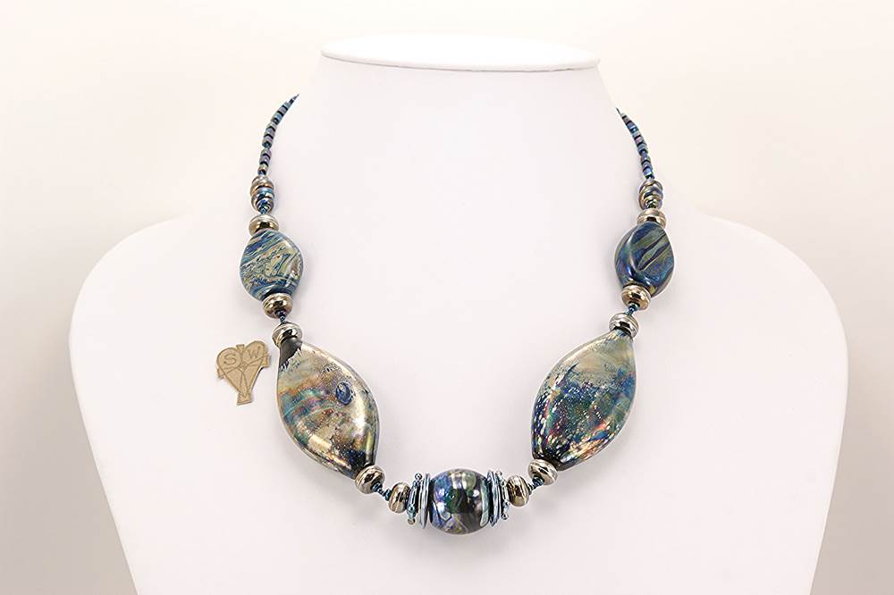 necklace with blue black glass beads, silver highlights.