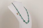 Kryptonite foam green colored glass bead necklace with sterling silver dotted accents and black spinel beads.