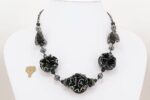 Necklace with black and sterling silver accented glass beads.