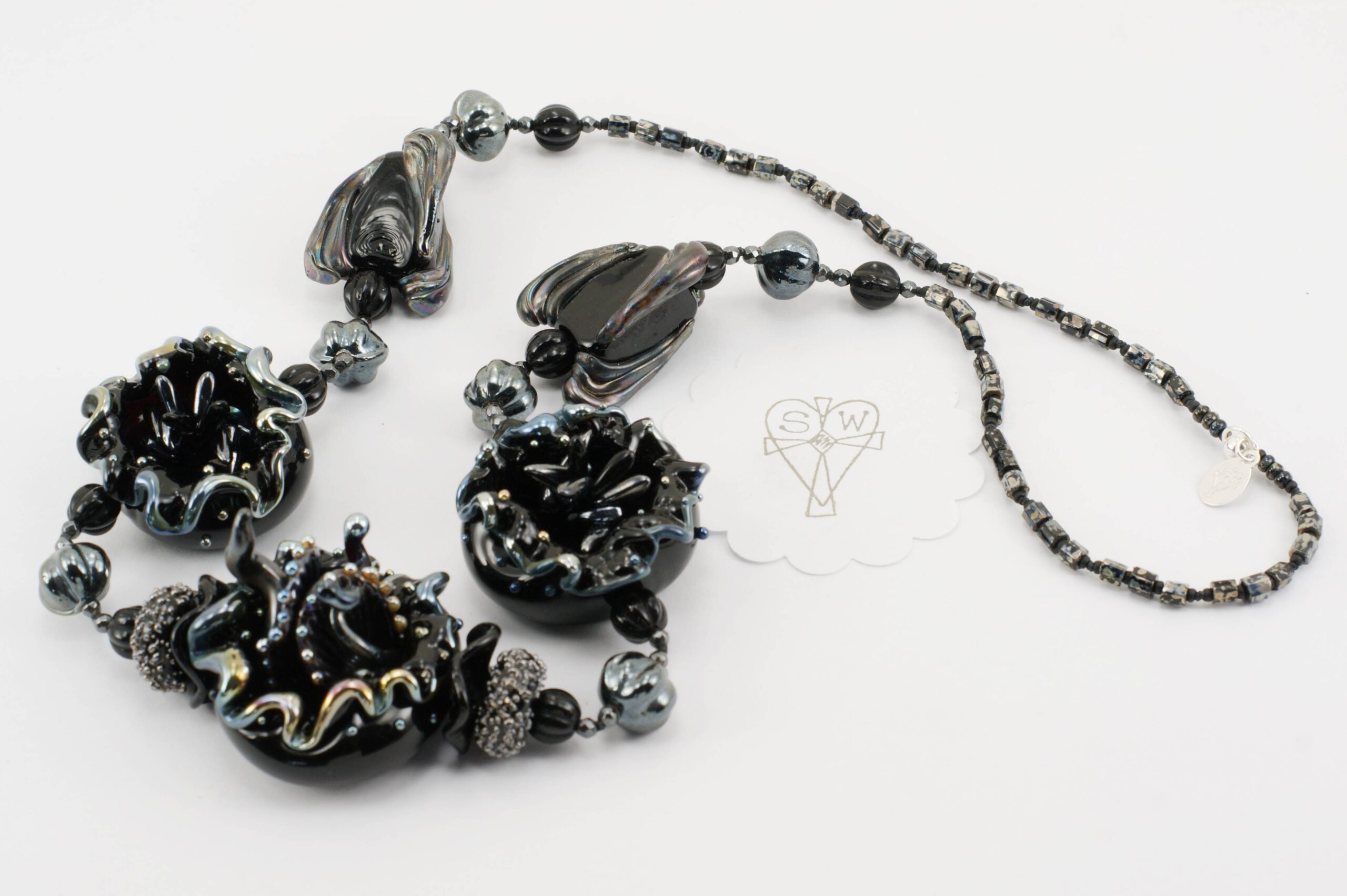 Necklace with handmade black and silver accented glass beads.