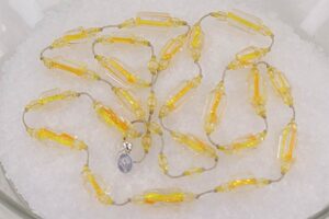 Bright yellow and orange glass beaded necklace.