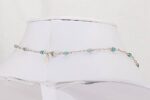 One of a kind necklace made of natural turquoise beads and sterling silver open box chain.
