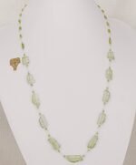 33 inch long necklace made of raw chrysolite stone slabs and peridot beads.