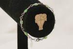 Green rutilated quartz beaded bracelet with sterling silver .
