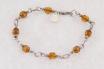 Bracelet handmade with vintage copper colored glass beads and sterling silver