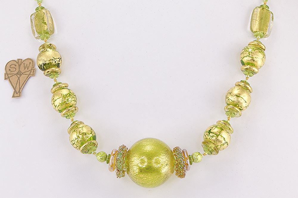 Unique necklace made of hand blown green and gold glass beads.