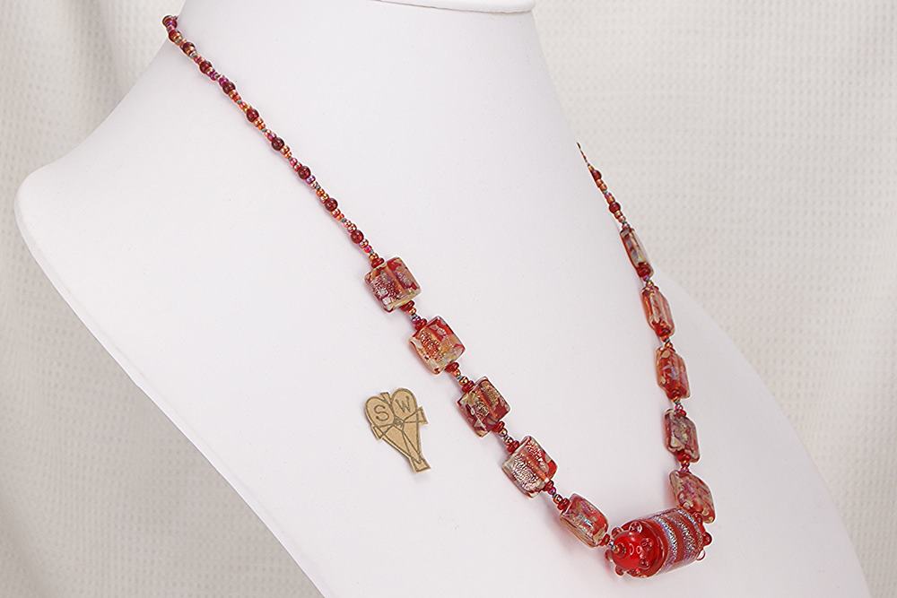One of a kind, eye catching necklace made of deep red dichroic and Murano glass beads