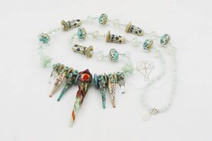 necklace made of amazonite and hand blown sage colored glass beads with sterling silver highlights.