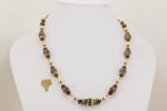 Chestnut, ivory and teal color glass bead necklace.