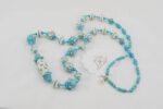 necklace with turquoise and ivory colored glass beads.