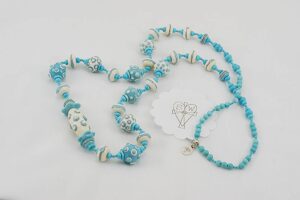 necklace with turquoise and ivory colored glass beads.