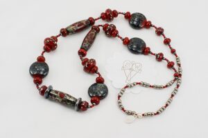 Red, black and grey glass bead necklace with silver raku effect.