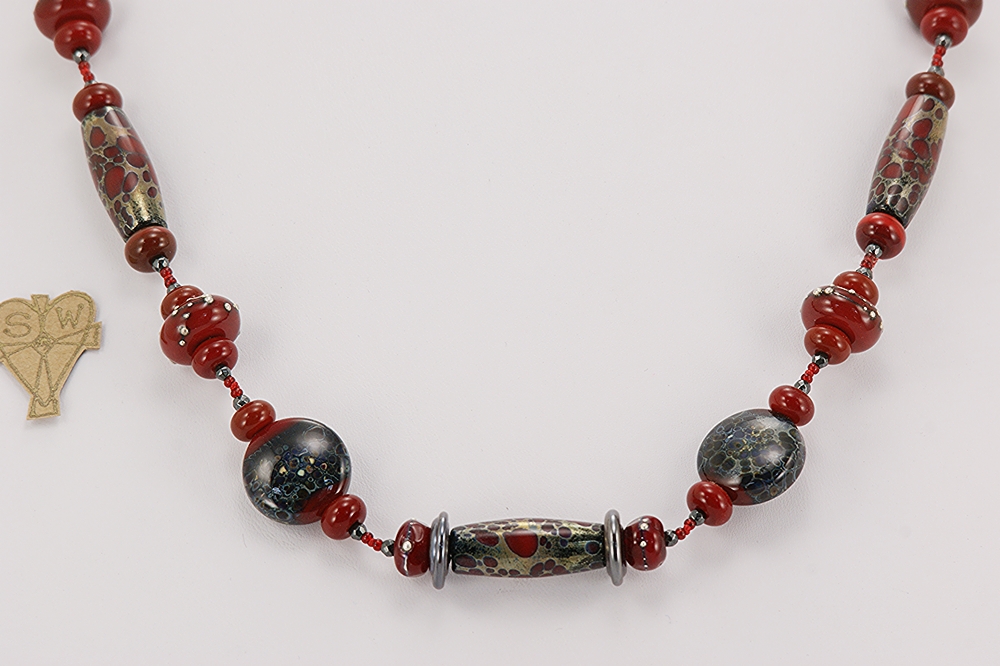 Red, black and grey color glass bead necklace.