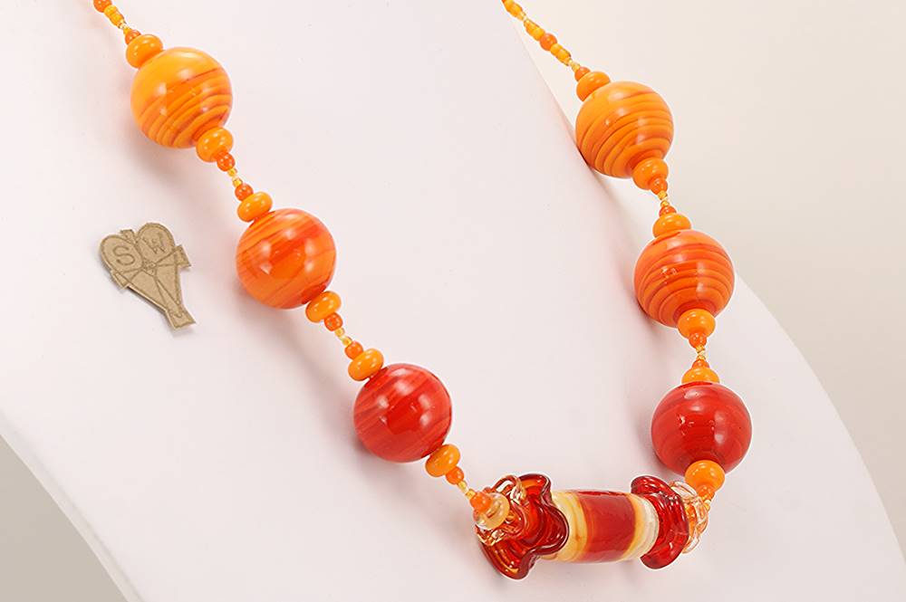 Bright orange glass bead necklace.