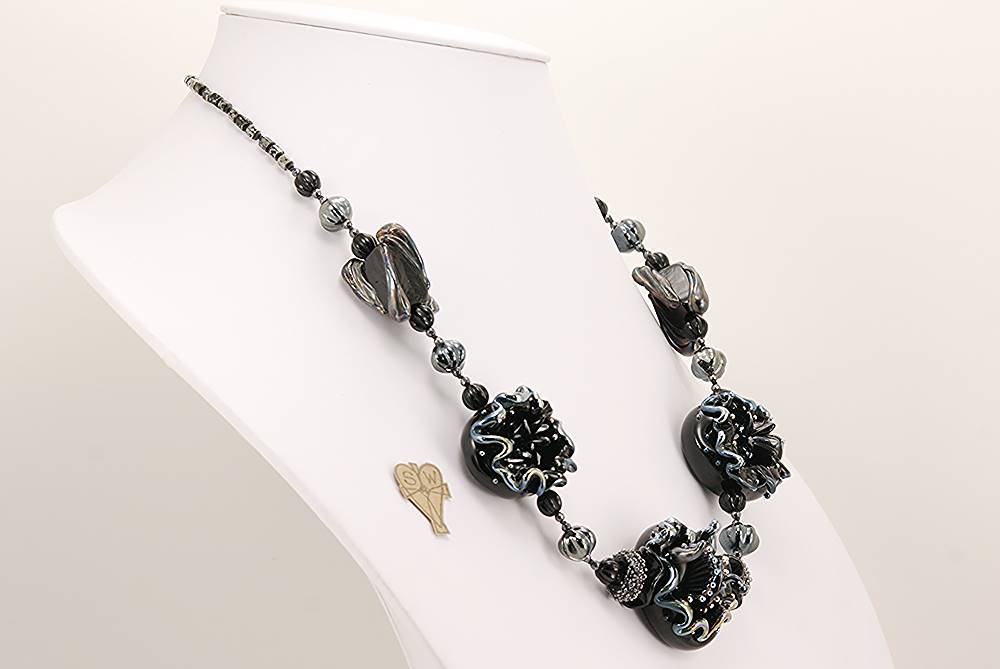 Necklace with black and silver glass beads.