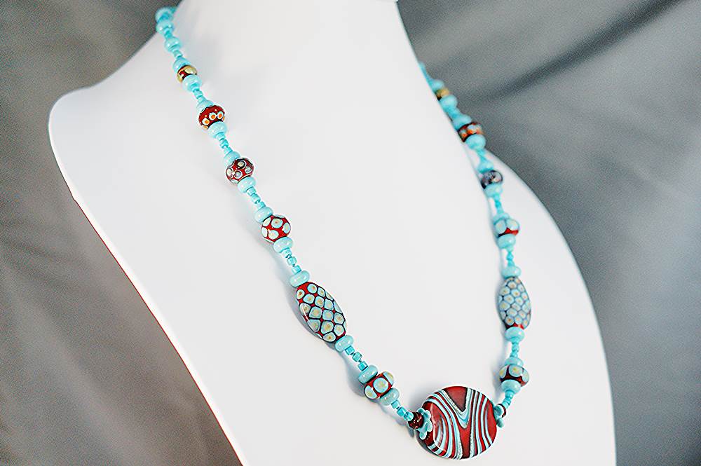 Handmade red and turquoise glass bead necklace.